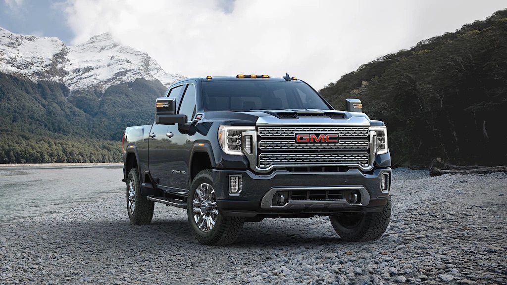 GMC Truck in front of mountains